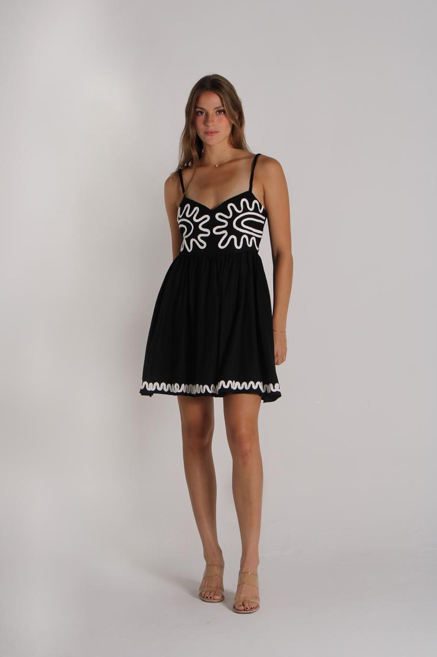 Short black dress with beige embroidery