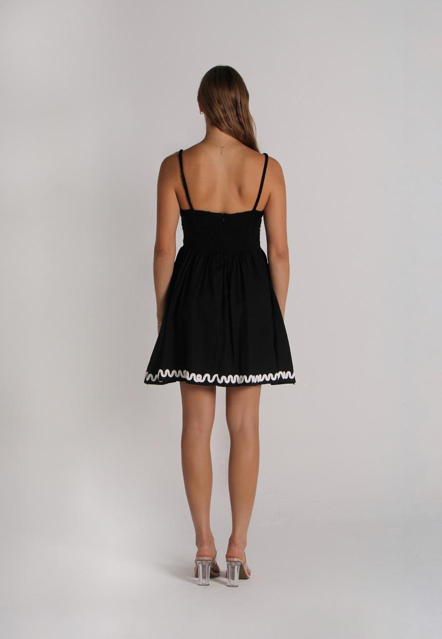 Short black dress with beige embroidery