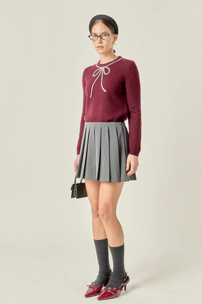 SWEATER WITH BOW AND GLITTER