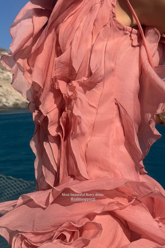 Close-up of a pink dress with a blurred background